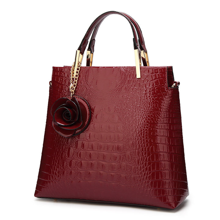 Damen Handtasche mit eleganter Kroko-Prägung und luxuriösen Details Nord Taschen