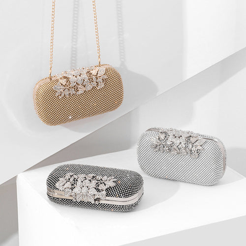 Damen Clutch mit funkelndem Strassdesign und floralem Akzent Nord Taschen