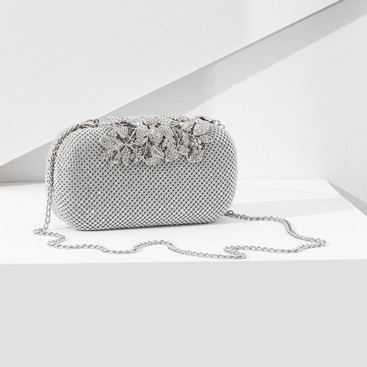 Damen Clutch mit funkelndem Strassdesign und floralem Akzent Nord Taschen