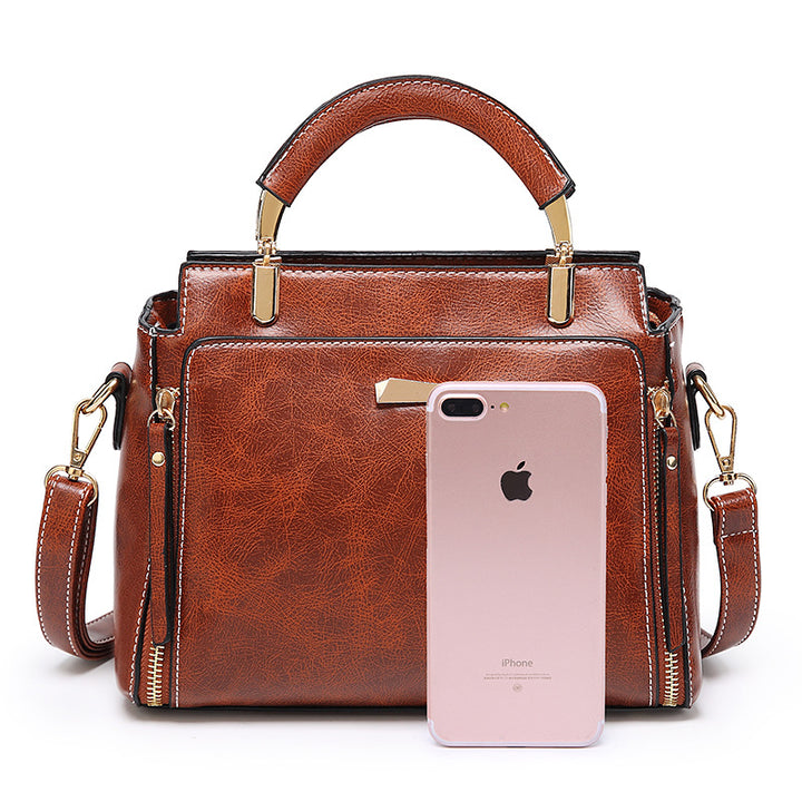 Damen Handtasche mit strukturiertem Kunstleder und goldenen Akzenten Nord Taschen