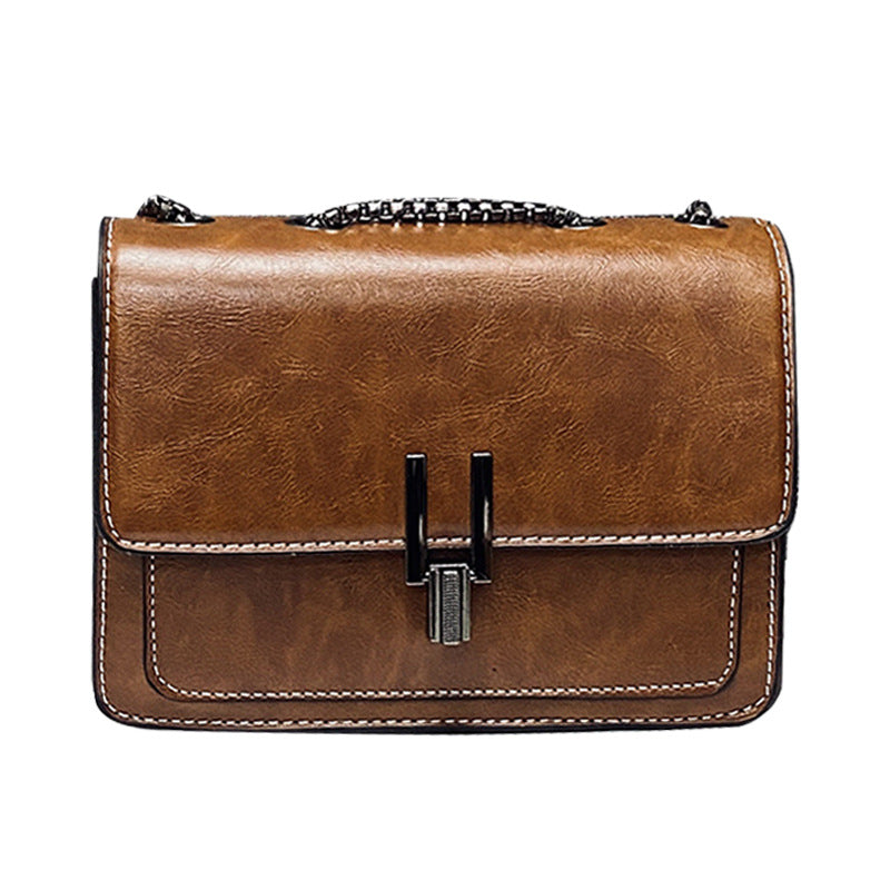 Damen Umhängetasche mit strukturiertem Kunstleder und eleganter Kettenapplikation Nord Taschen