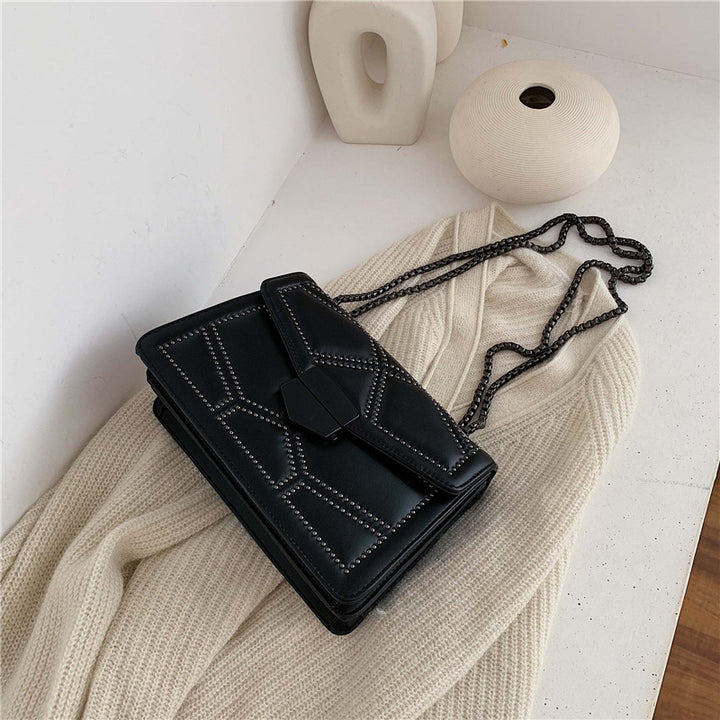 Damen elegante Clutch mit strukturiertem Design und modischem Kettenriemen Nord Taschen