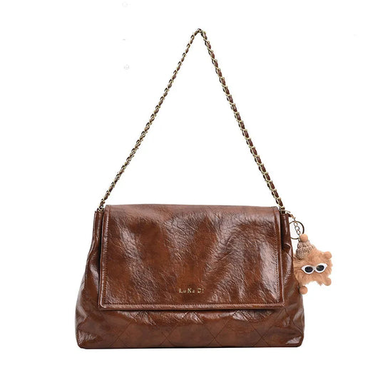 Nord Taschen | Handtasche für Damen - Geräumiges Design mit Kettenhenkel und niedlichem Anhänger