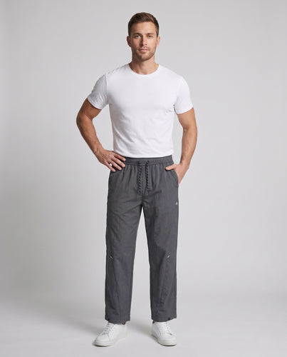 Unisex Leichte weite Nylon-Trainingshose mit Tunnelzug, verstellbarem Beinabschluss und reflektierenden Details Nord Taschen