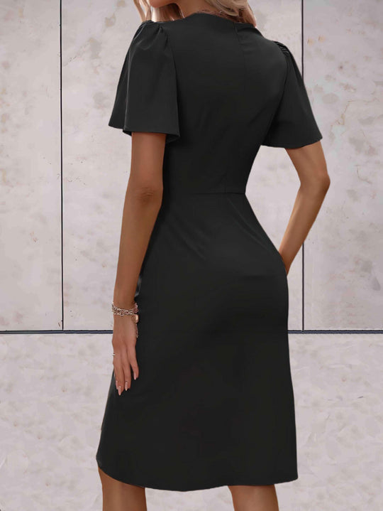 elegante wikkeljurk met korte mouwen