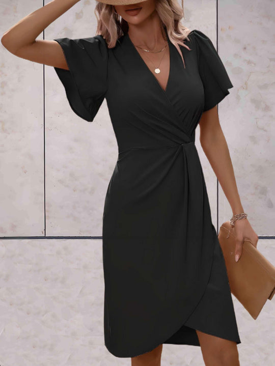 elegante wikkeljurk met korte mouwen