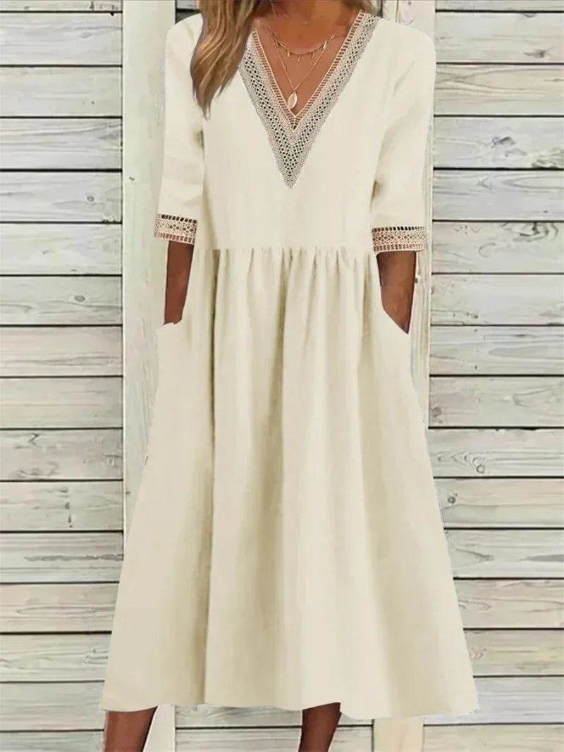 Kleid mit Spitzenverzierung und halben Ärmeln