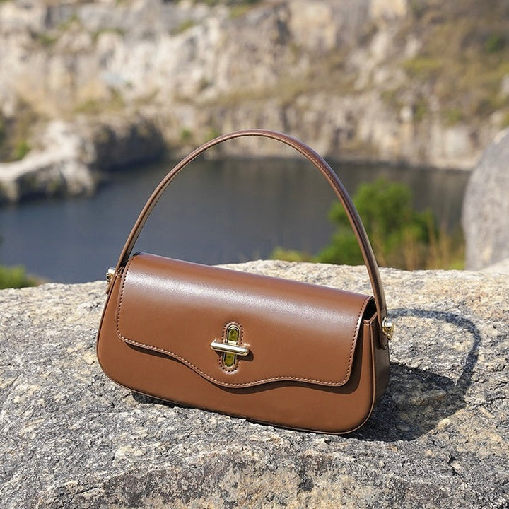 Nord Taschen | Schultertasche mit goldenem Drehverschluss und Crossbody-Tragegurt