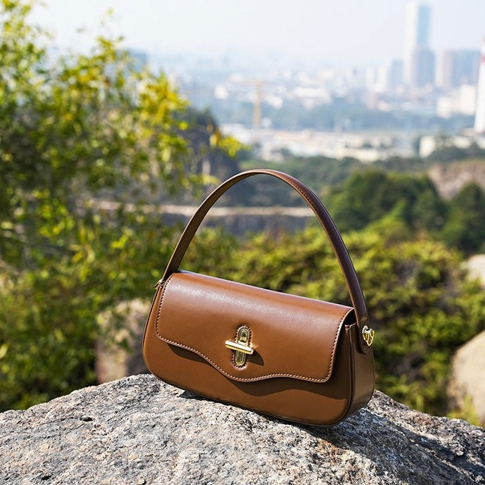 Nord Taschen | Schultertasche mit goldenem Drehverschluss und Crossbody-Tragegurt