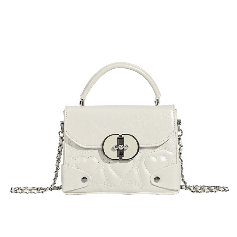 Damen Handtasche mit herzförmigem Design und schickem Kettenriemen Nord Taschen
