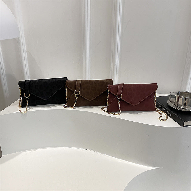 Damen elegante Clutch mit Kettenakzent Nord Taschen