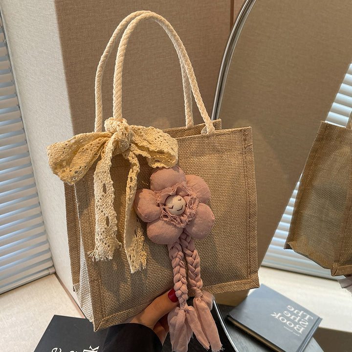 Damen Handtasche mit floralen Details und romantischem Bogen Nord Taschen