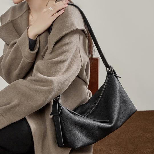 Damen Umhängetasche mit geschwungenem Design und praktischen Reißverschlusstaschen Nord Taschen