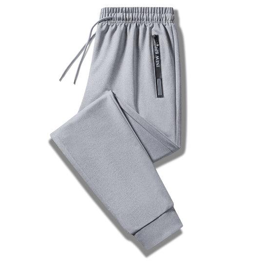 Herren Sportliche Trainingshose mit elastischem Tunnelzugbund, Reißverschlusstasche und glattem Performance‑Material Nord Taschen