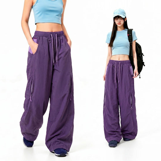Damen Oversize Tech-Loungehose mit Kontrastnähten, reflektierenden Reißverschlusstaschen & Kordelbund Nord Taschen