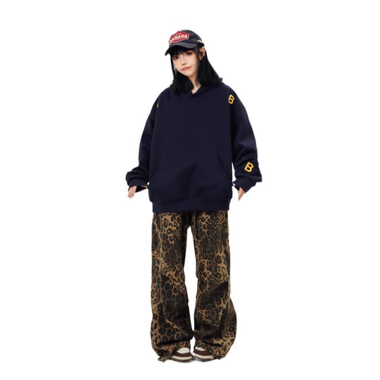 Unisex Oversized Kapuzenpullover mit großflächigem Intarsien‑Blockprint und geripptem Saum Nord Taschen