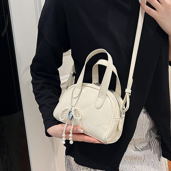 Damen Mini-Handtasche mit stilvollem Krokodil-Look und abnehmbarem Anhänger | Nord Taschen