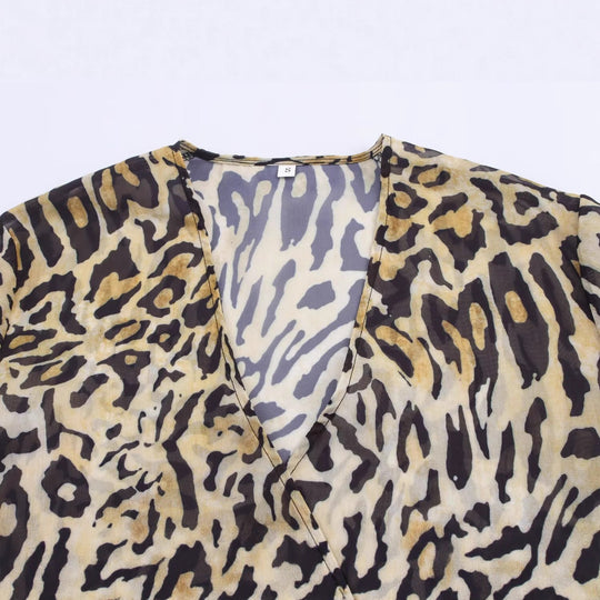 Damen Asymmetrische Wickelbluse mit Leopardenmuster, V-Ausschnitt, Ballonärmeln und Taillengürtel Nord Taschen