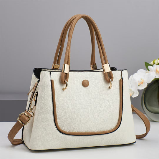 Damen Handtasche mit goldenen Akzenten und eleganter Struktur Nord Taschen