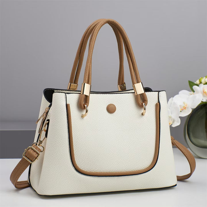 Damen Handtasche mit goldenen Akzenten und eleganter Struktur Nord Taschen