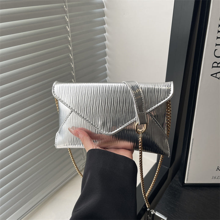 Damen elegante Clutch mit schimmerndem Wellenmuster Nord Taschen
