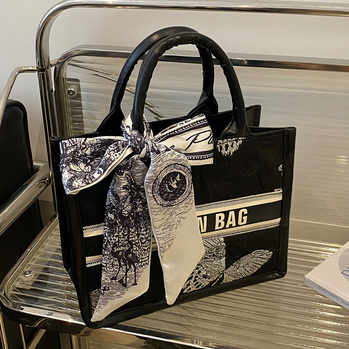 Damen Handtasche im eleganten Design mit dekorativem Schal Nord Taschen