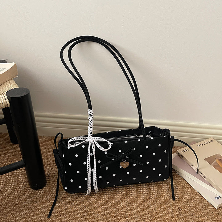 Damen Handtasche mit spielerischem Punktemuster und eleganten Details Nord Taschen