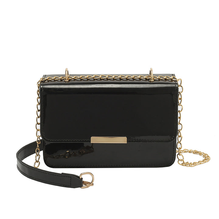 Damen elegante Umhängetasche mit glänzender Oberfläche und goldenen Akzenten Nord Taschen