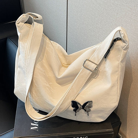 Damen Umhängetasche aus leichtem Material mit dekorativem Schmetterlingsdetail Nord Taschen