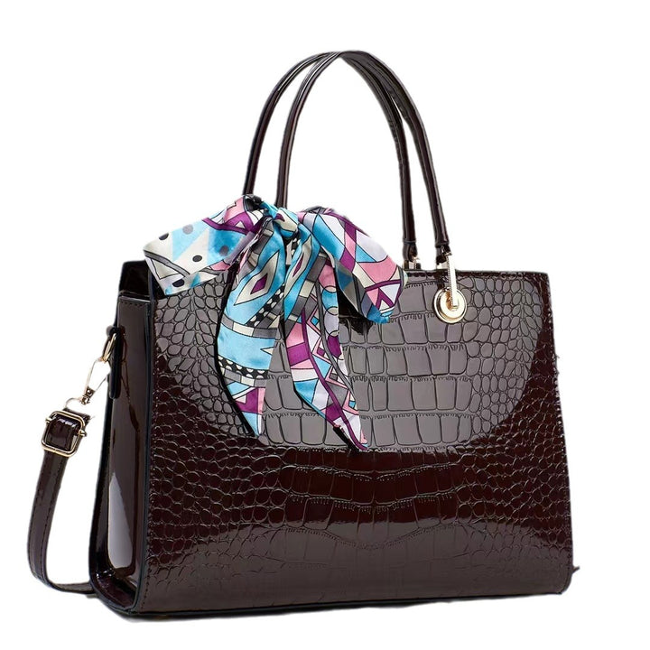 Damen elegante Handtasche mit prominenter Schlangenleder-Prägung und modischem Schal Nord Taschen