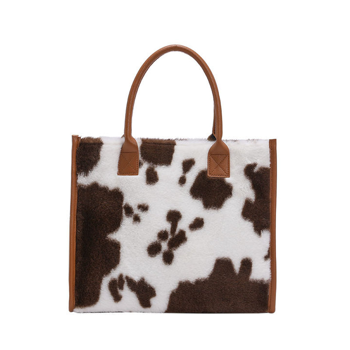 Damen Handtasche mit kuscheligem Kunstfell und eleganten Detailverzierungen Nord Taschen