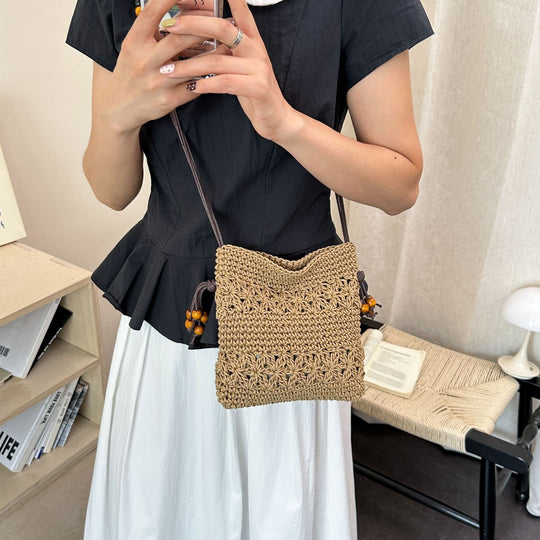 Damenhandtasche aus handgewebtem Naturmaterial mit verspielten Details Nord Taschen