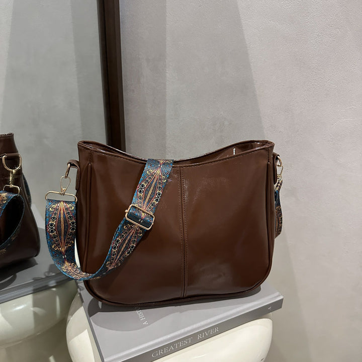 Damen Umhängetasche mit auffälligem dekorativem Trageriemen Nord Taschen