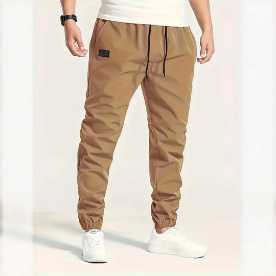 Herren Technische Jogginghose im Tapered‑Utility‑Stil mit elastischem Bund & Knöchelbündchen Nord Taschen