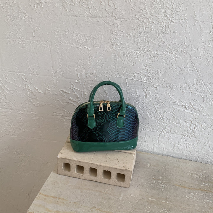 Damen elegante Handtasche im stilvollen Schlangenleder-Look Nord Taschen