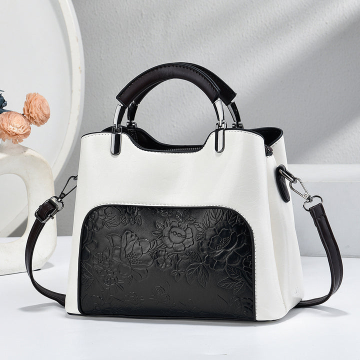 Damen elegante Handtasche mit floralem Relief Nord Taschen