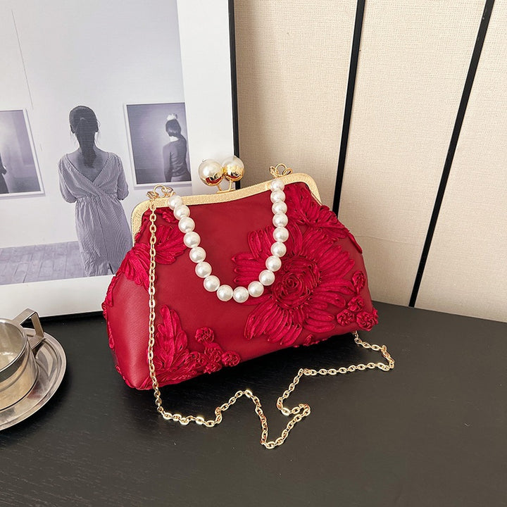 Damen elegante Clutch mit floralen Stickereien und Perlenakzenten Nord Taschen