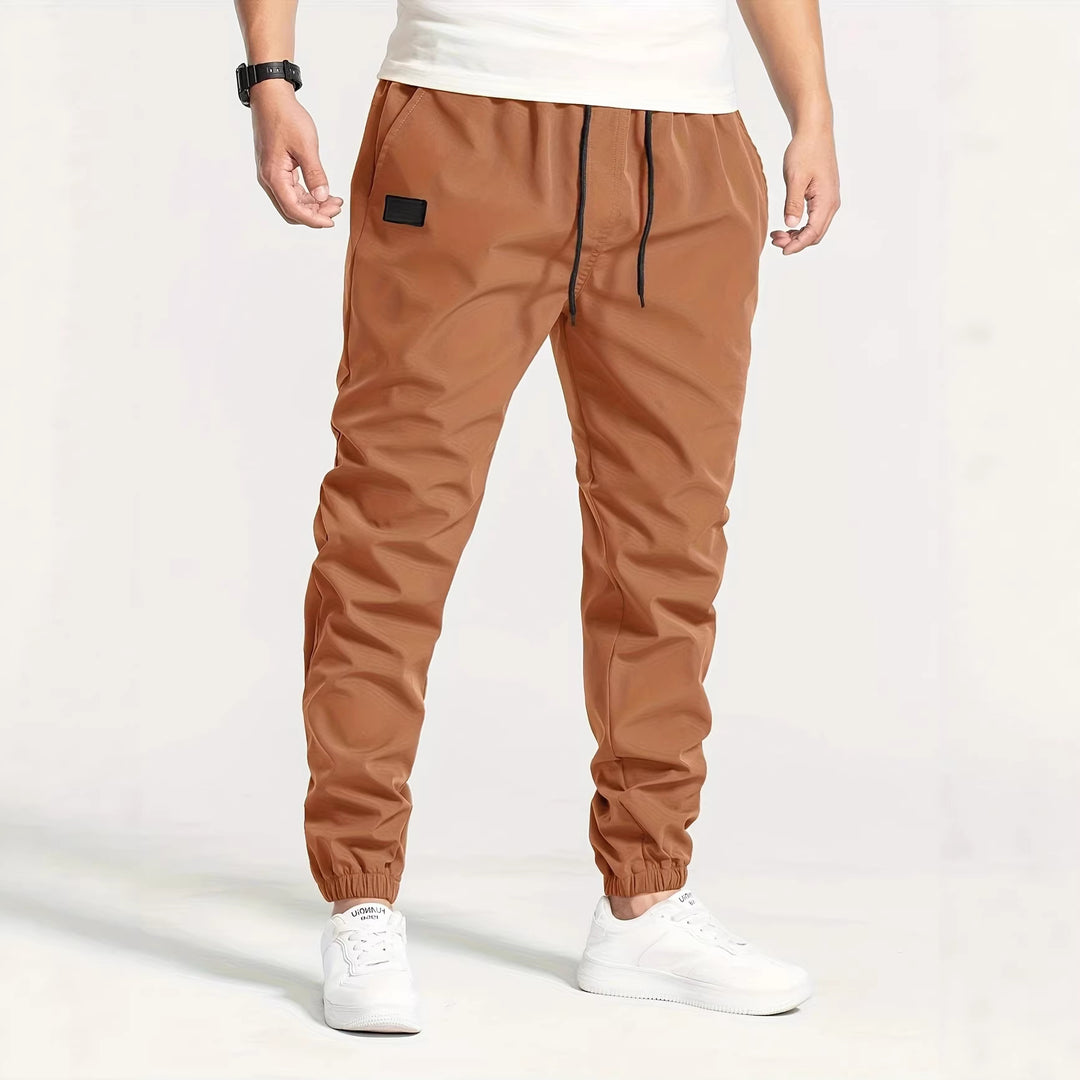 Herren Technische Jogginghose im Tapered‑Utility‑Stil mit elastischem Bund & Knöchelbündchen Nord Taschen