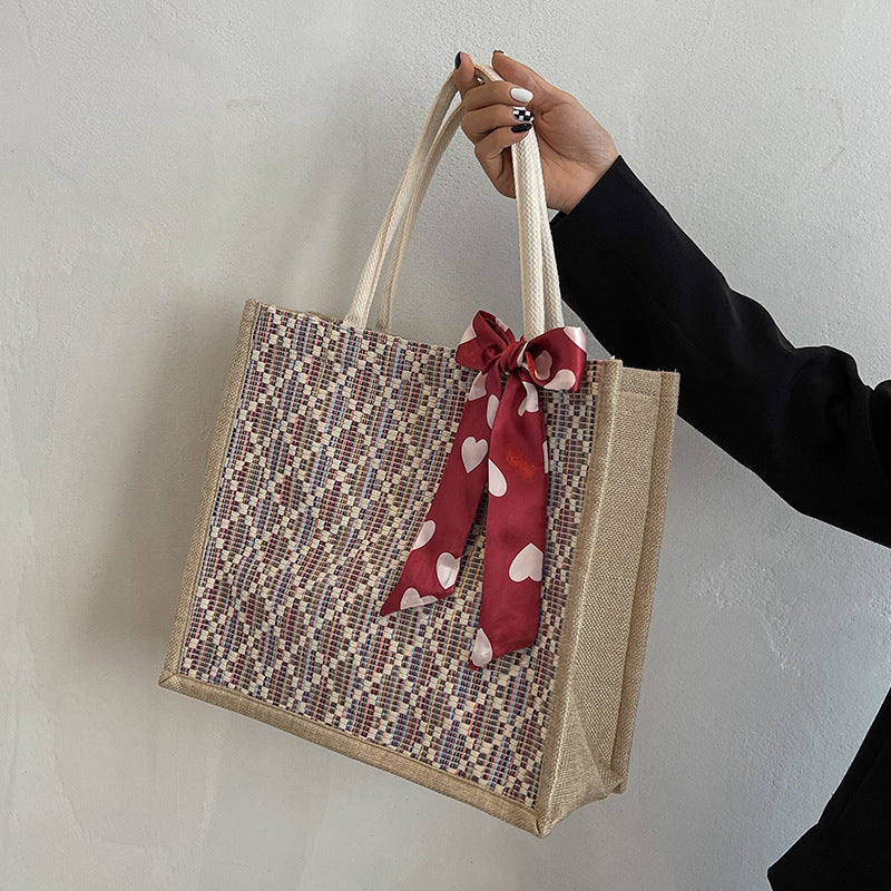 Damen Jute-Einkaufstasche mit buntem Grafikdesign und dekorativem Schleifenakzent Nord Taschen