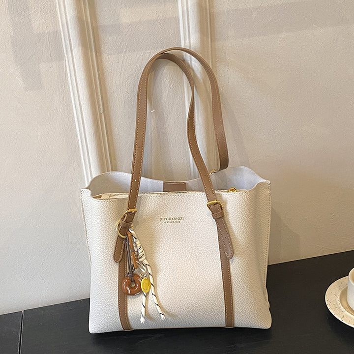 Damen elegante Handtasche im minimalistischen Stil mit einzigartigem Anhänger Nord Taschen