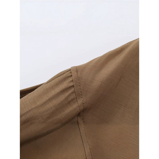 Damen Kurz geschnittene plissierte Blousonjacke mit Ballonärmeln und Smockbund Nord Taschen