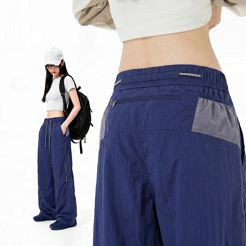 Damen Oversize Tech-Loungehose mit Kontrastnähten, reflektierenden Reißverschlusstaschen & Kordelbund Nord Taschen