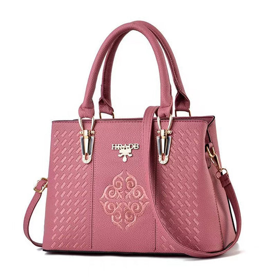 Damen elegante Handtasche mit aufwendigem gewebtem Design und kontrastierender Verzierung Nord Taschen