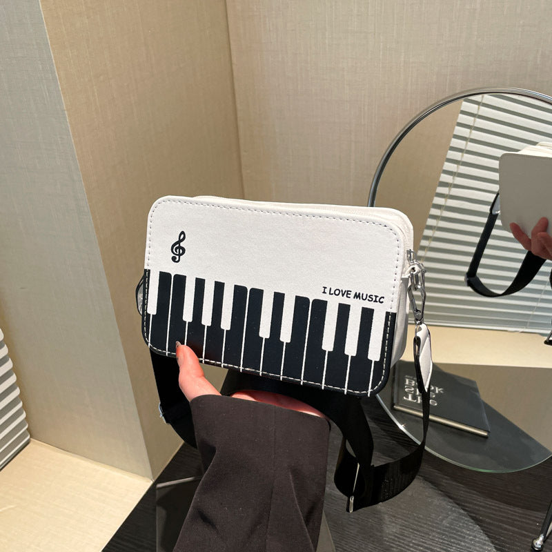 Damen Umhängetasche mit musikalischem Klaviertastendesign Nord Taschen