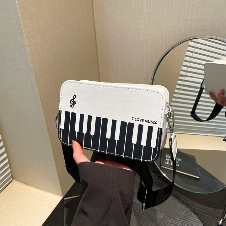 Damen Umhängetasche mit musikalischem Klaviertastendesign Nord Taschen