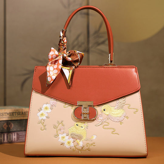 Damen Handtasche mit floraler Stickerei und modischem Schal Nord Taschen