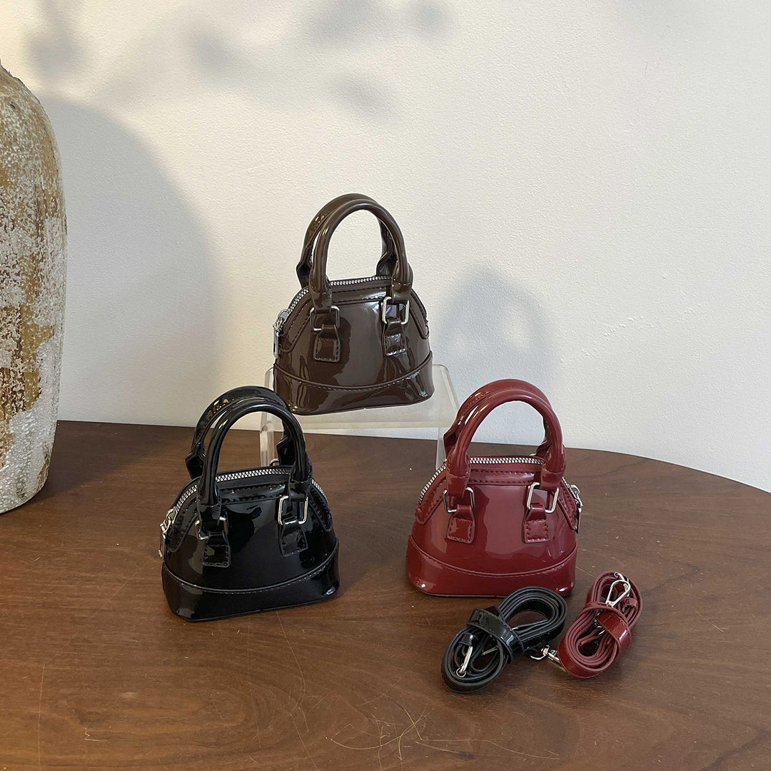 Damen Mini-Handtasche mit glänzender Oberfläche und modischem Reißverschluss Nord Taschen