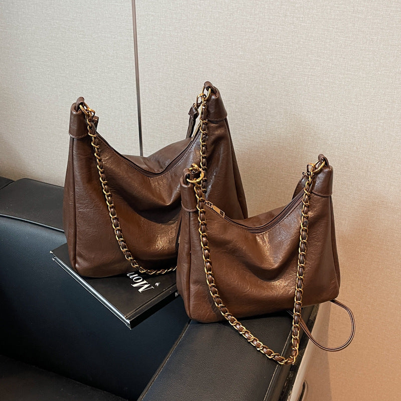 Damen stylische Umhängetasche mit goldenen Kettendetails Nord Taschen