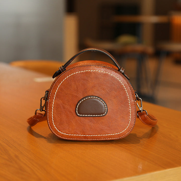 Damen Designer Handtasche mit modernem Rundschnitt und hochwertiger Lederverarbeitung Nord Taschen