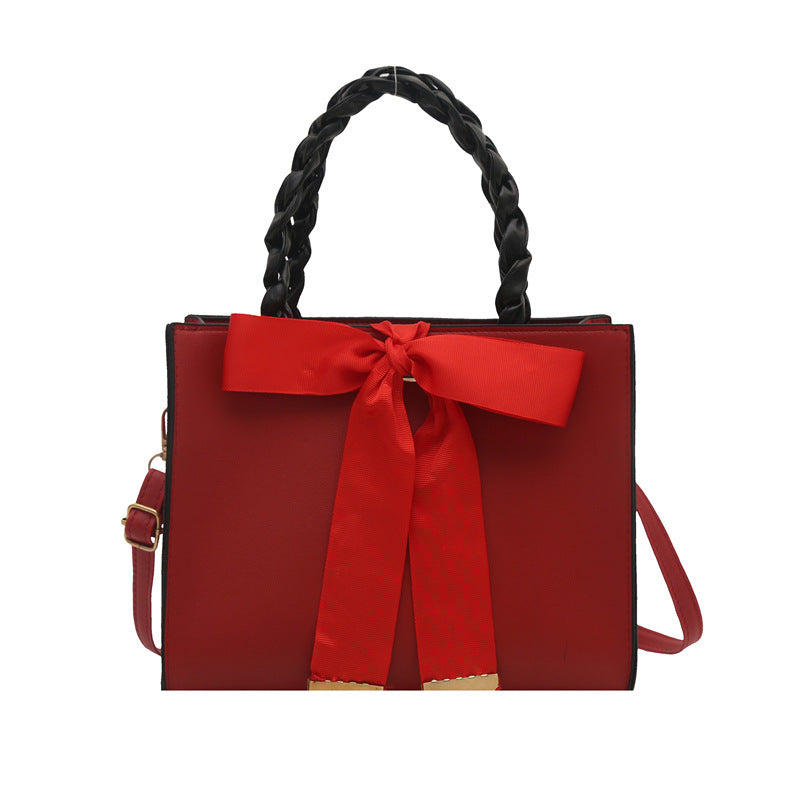 Damen elegante Handtasche mit geflochtenem Ledergriff und Schleifenakzent Nord Taschen